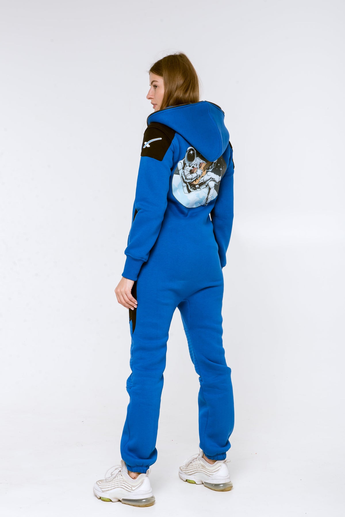Women's Space X blue jumpsuit, side view: astronaut print on the back | THE ONE