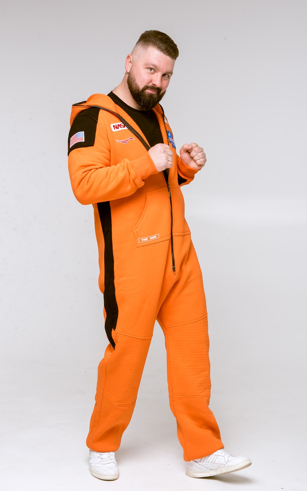 Men's Space X orange jumpsuit, side view: black stripes, astronaut-suit look | THE ONE